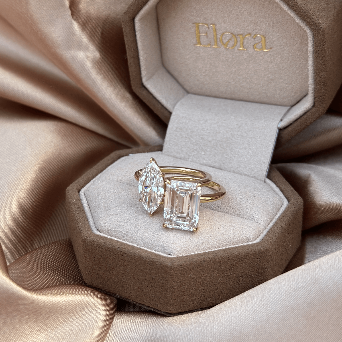 14K yellow gold emerald diamond ring on neutral background, full shine