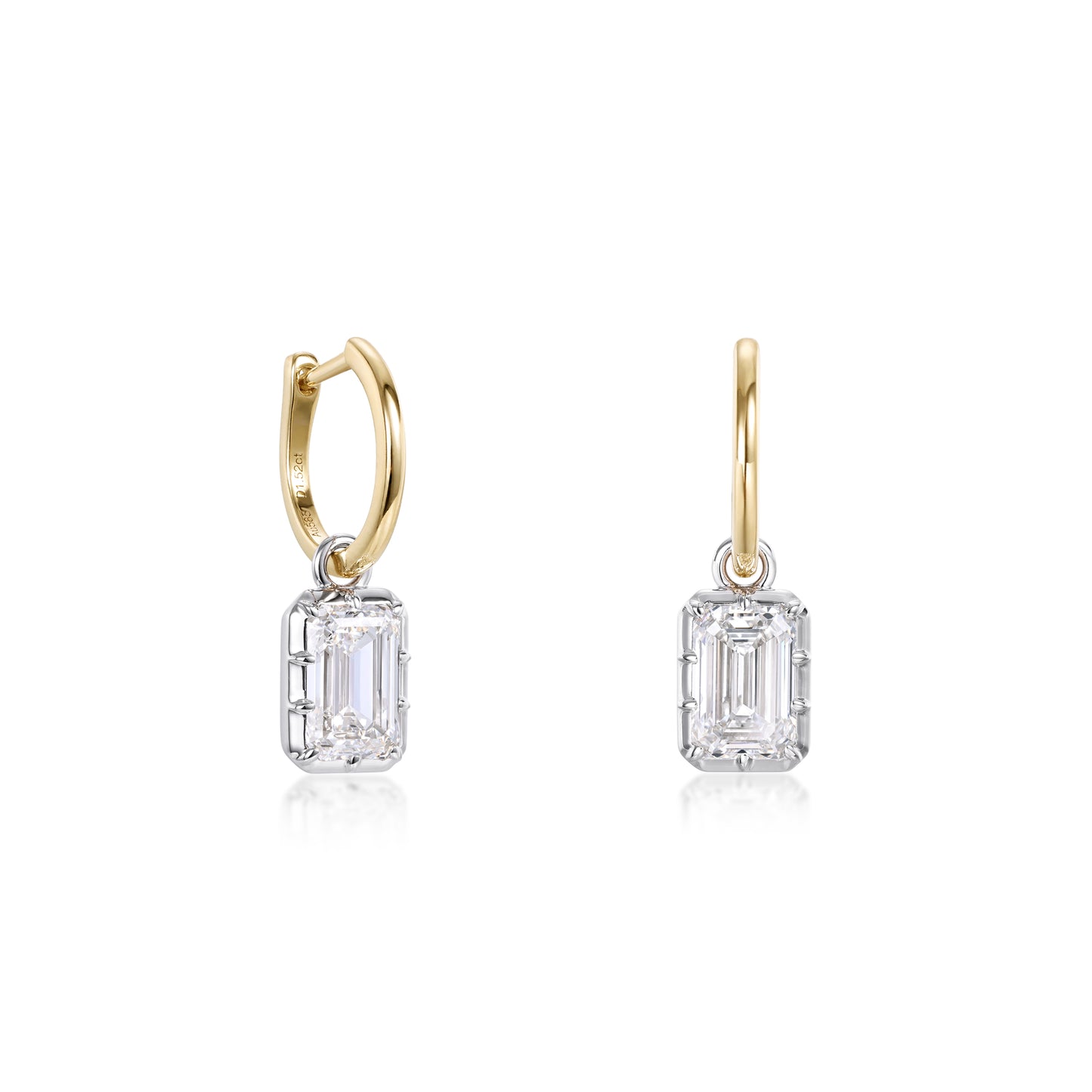 Bezel Emerald Diamond Drop Hoop Earrings in yellow gold with emerald cut diamonds in white gold bezel settings.