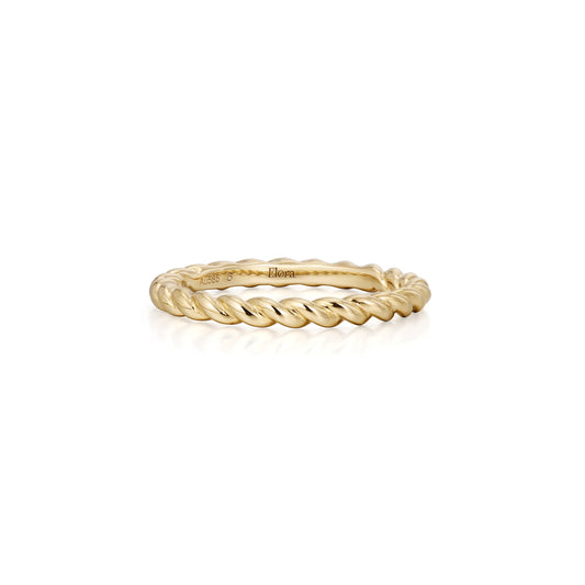 Gold ring with twisted design on a white background