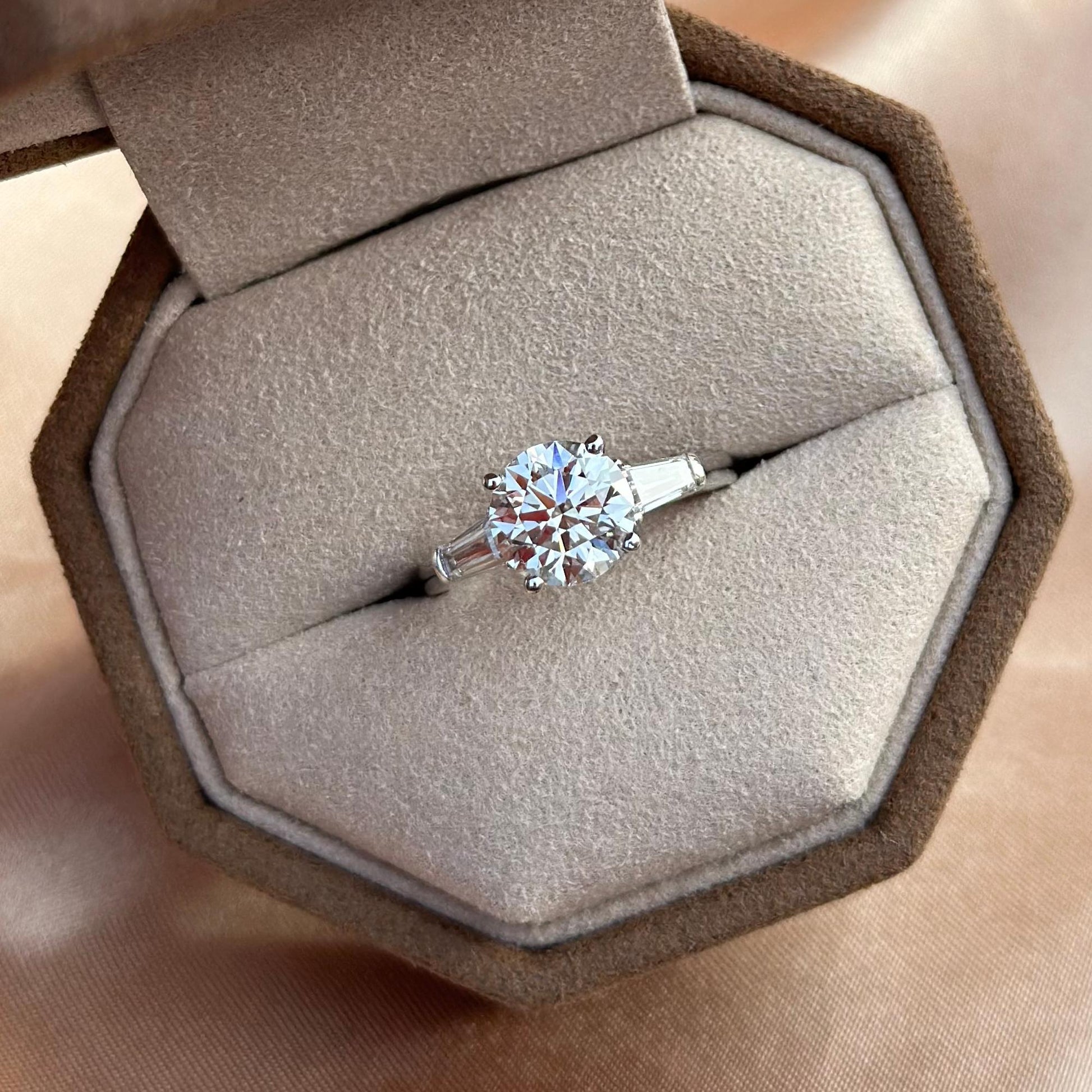 Amber Three Stone Round Cut Lab Grown Diamond Ring shown inside Elora jewelry box