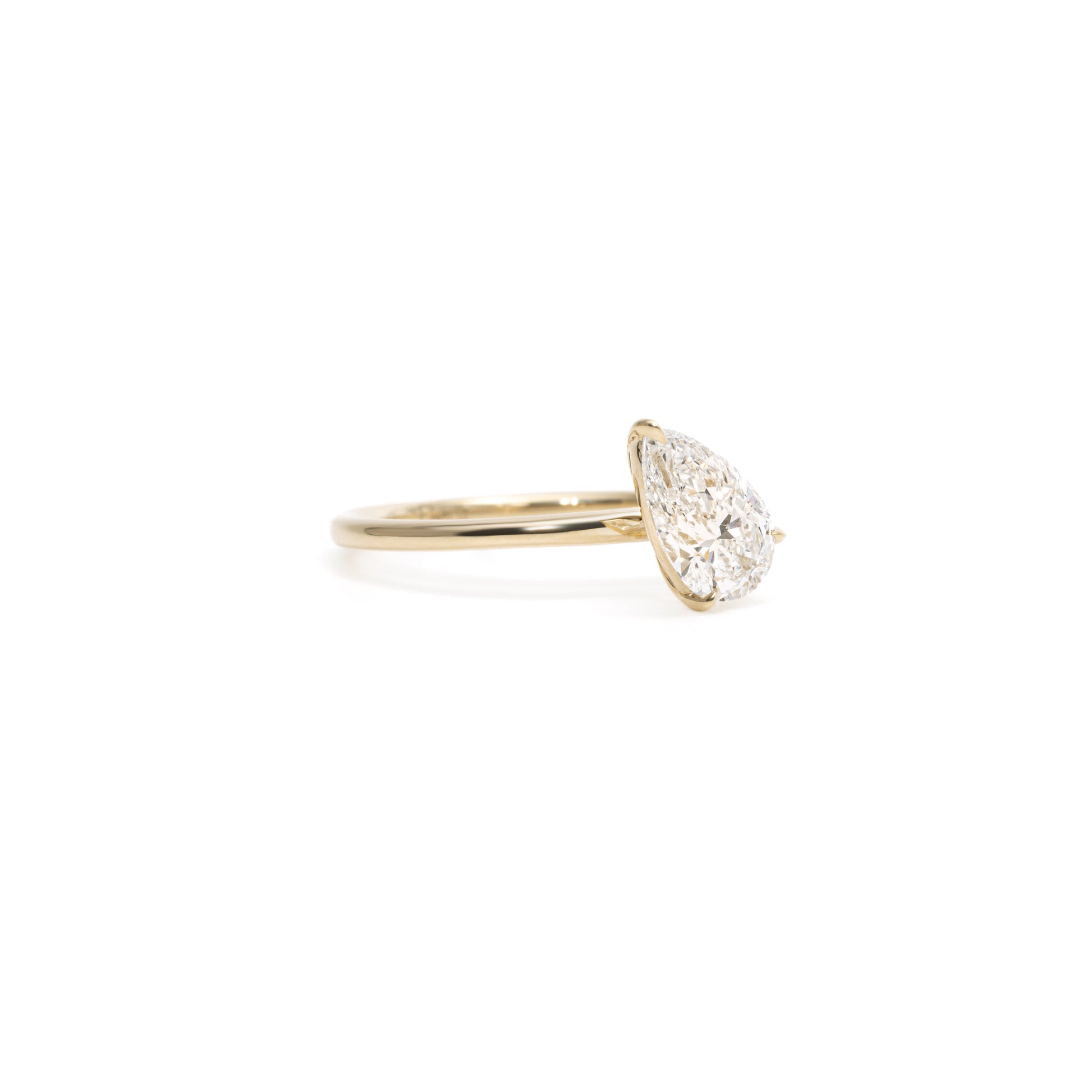 Angled view Remi Tilted Pear Cut Lab Diamond Soliatire Wedding Ring