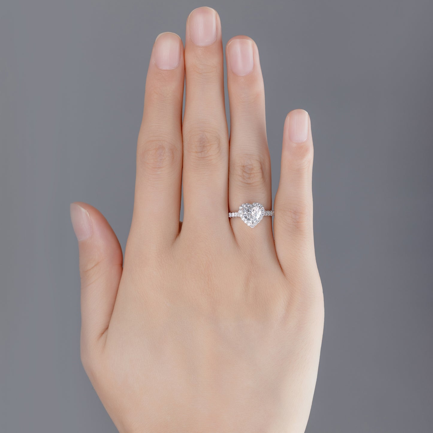 Anica Heart Cut Pavé Lab Grown Diamond Halo Ring in platinum on ring finger