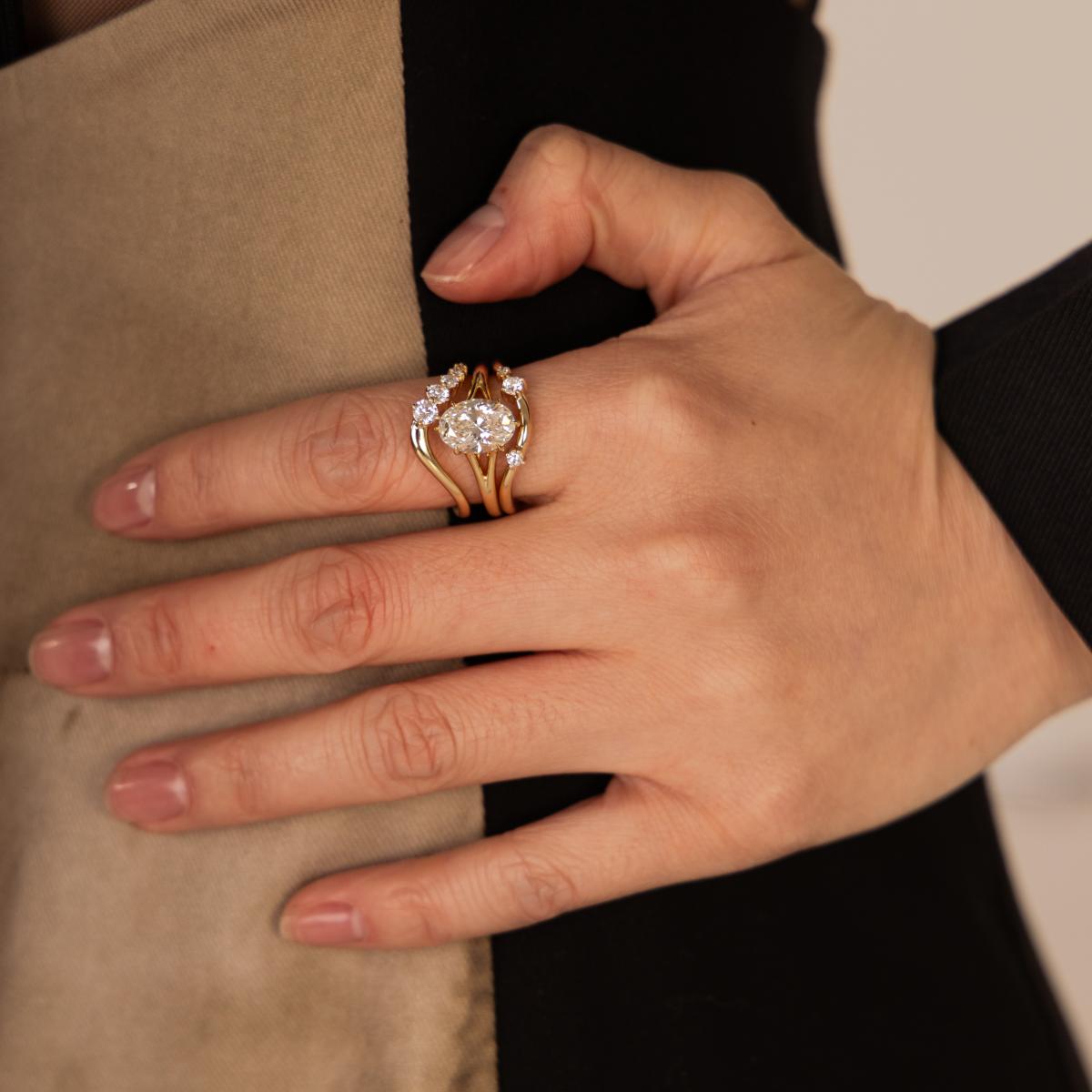 Bold stacked ring look with Edith Oval diamond ring paired with contour and curved bands