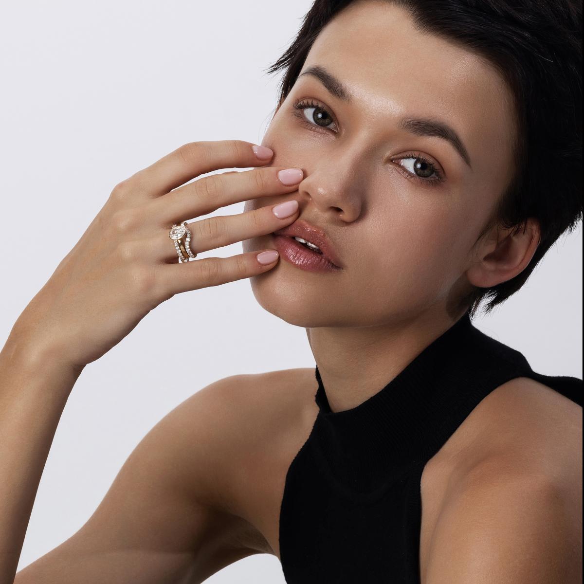 Bold stacked ring look with Oval Cut Diamond Ring paired with pavé and curved bands