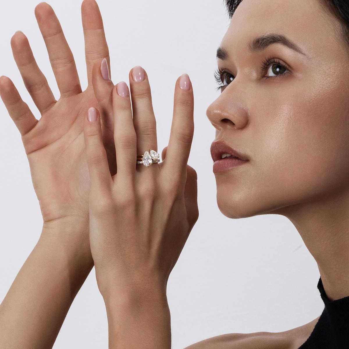 Bold stacked ring look with Pear Cut Lab Grown Diamond Ring paired with pavé and plain bands