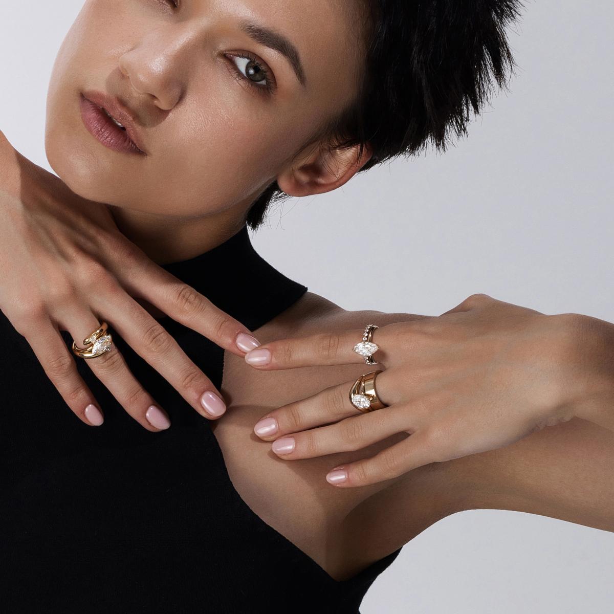 Bold stacked ring look with the Solitare diamond rings paired with pavé and Curved bands, Plain gold ring