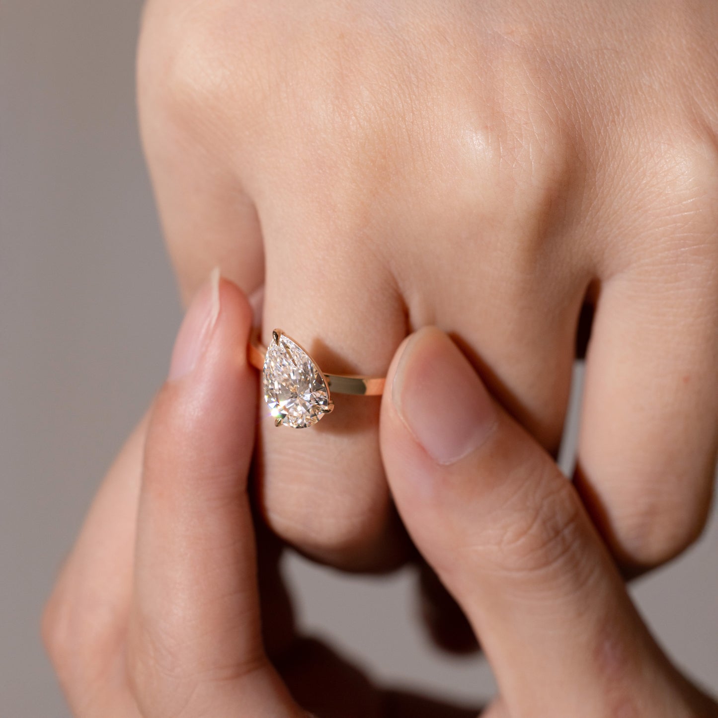 Close-up detail Pear Cut Lab Diamond Solitaire Ring