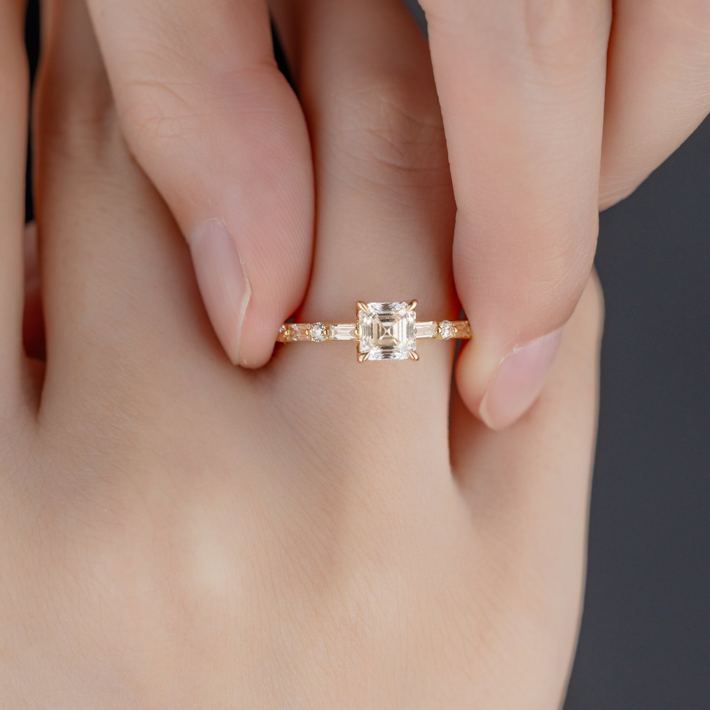 Close-up detail of Asscher cut lab-grown diamond pavé ring in 14K gold