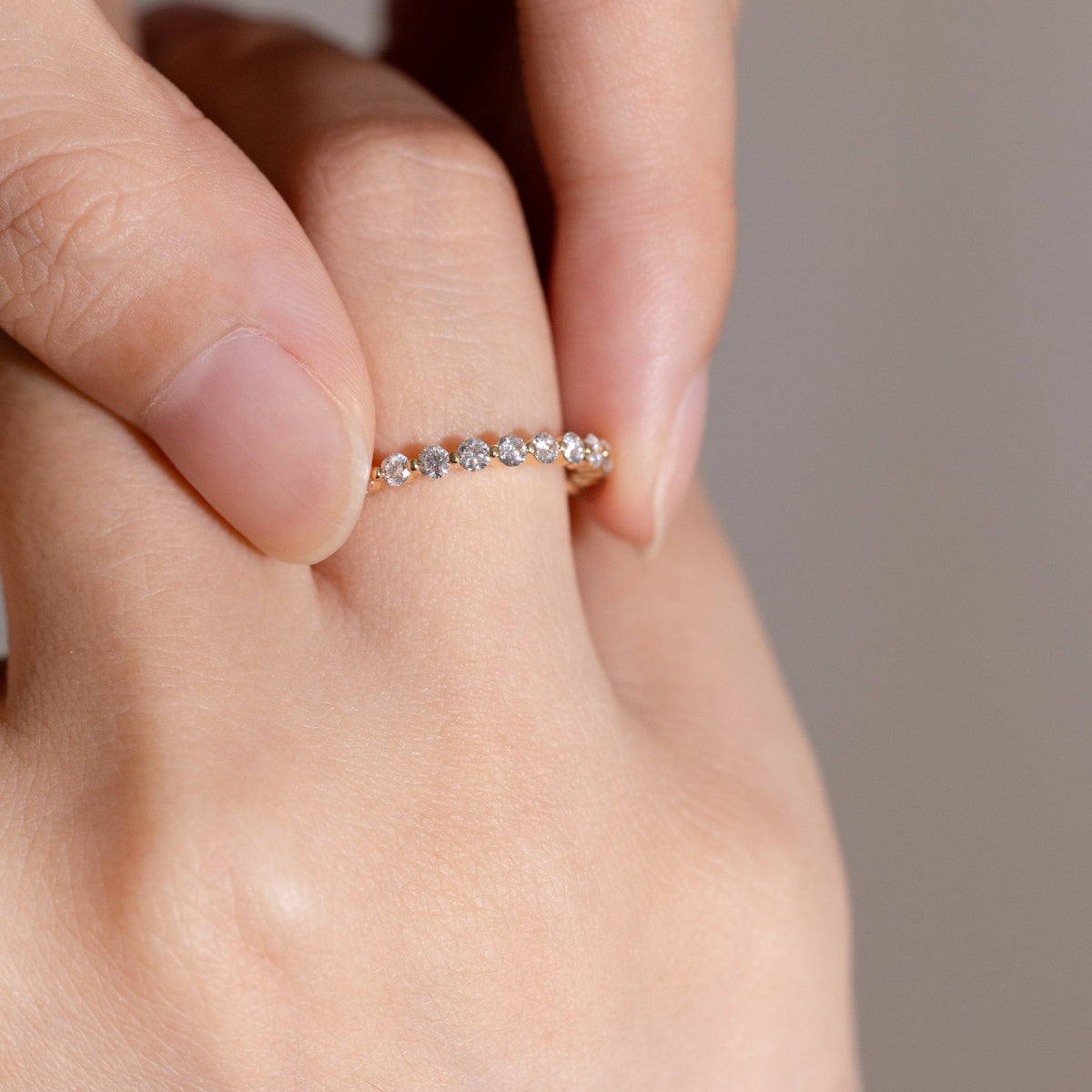 Close-up of the Aura eternity band ring, symbolizing eternal love and light