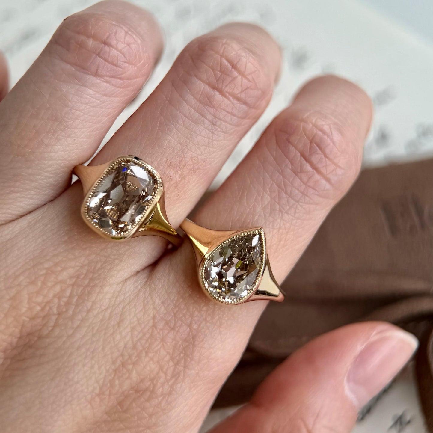 Eddy-Champagne Old Mine Pear Lab Grown Diamond Ring showcasing vintage design and light brown champagne diamonds.