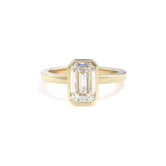 Front view of Aurora Emerald Cut Lab Grown Diamond Bezel Ring in 14K yellow gold