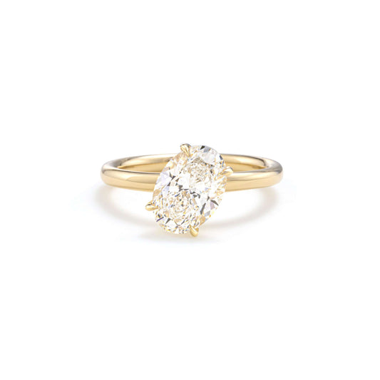 Front view of Mira Tilted Oval cut lab-grown diamond solitaire ring in 14K yellow gold