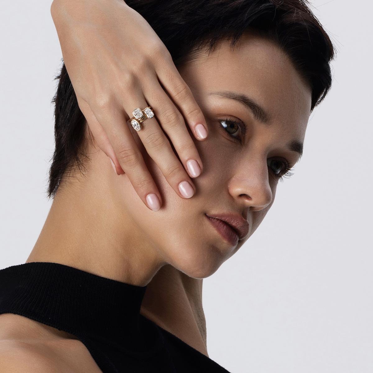 Hand-closeup of Old European cut Diamond ring Stacking with other bezel setting rings