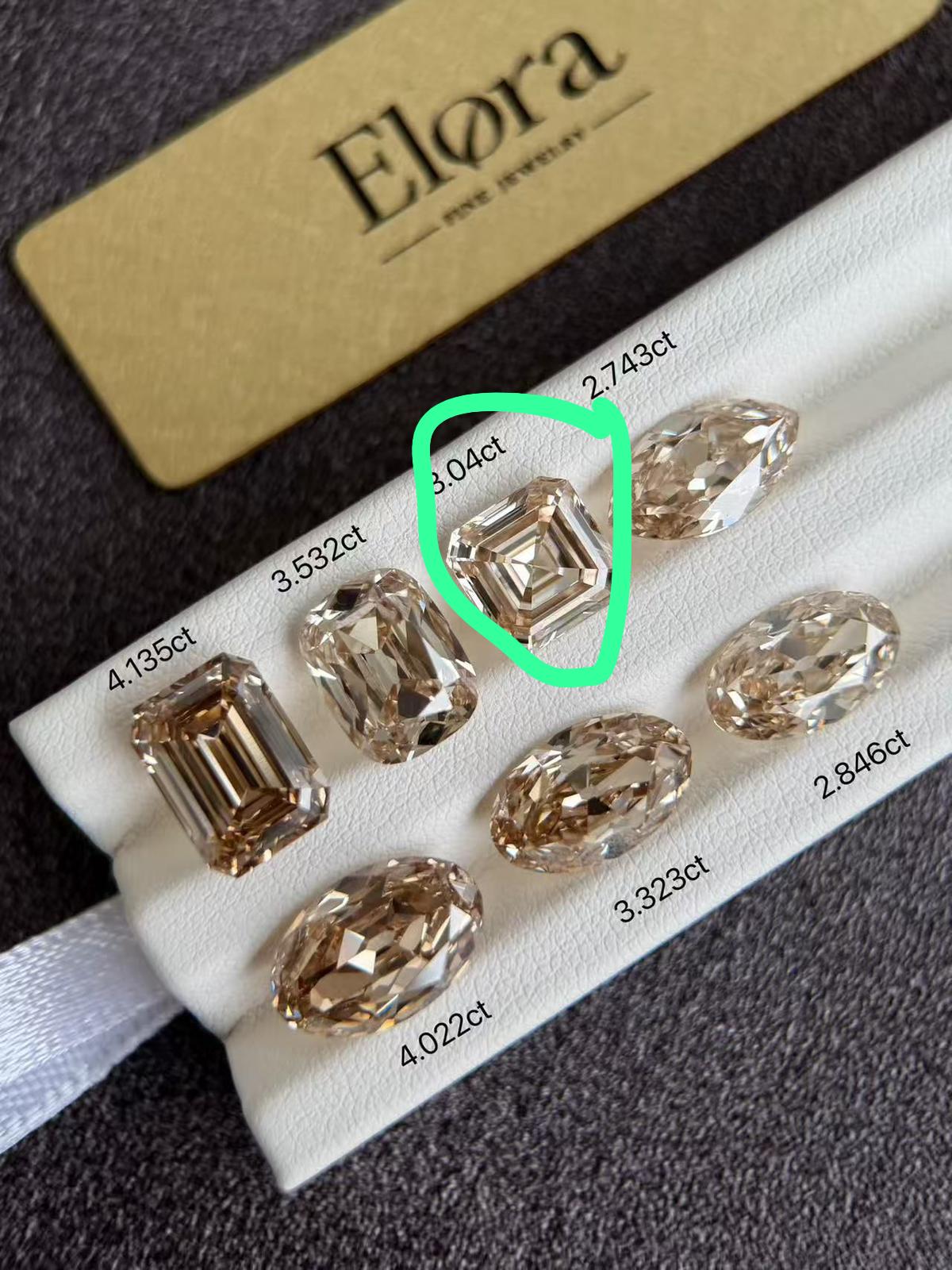 Custom Order - 3ct Champagne Asscher Cut Lab Diamond Ring with 3.04ct center stone displayed among other diamonds