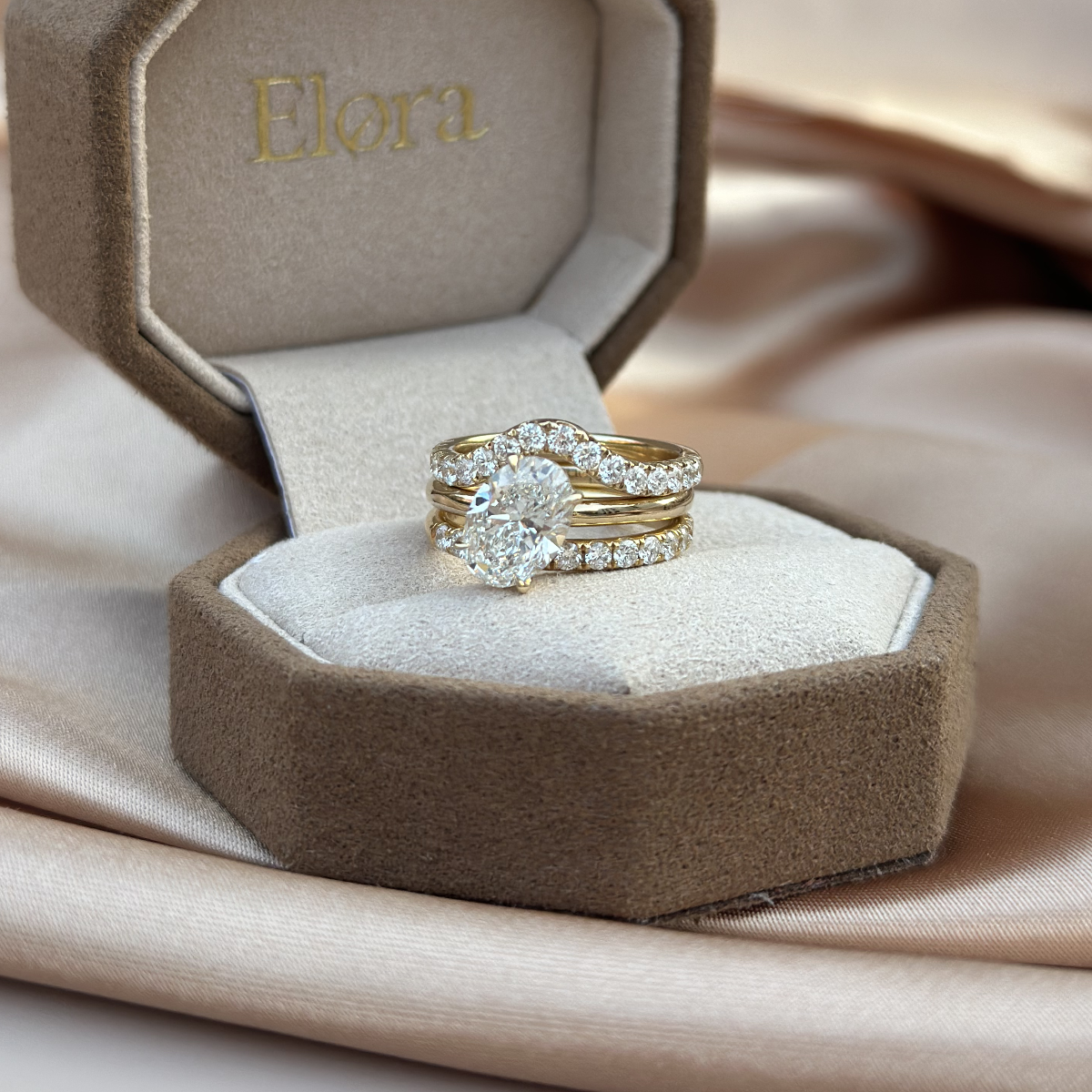 Mira tilted oval cut diamond ring displayed in Elora velvet jewelry box
