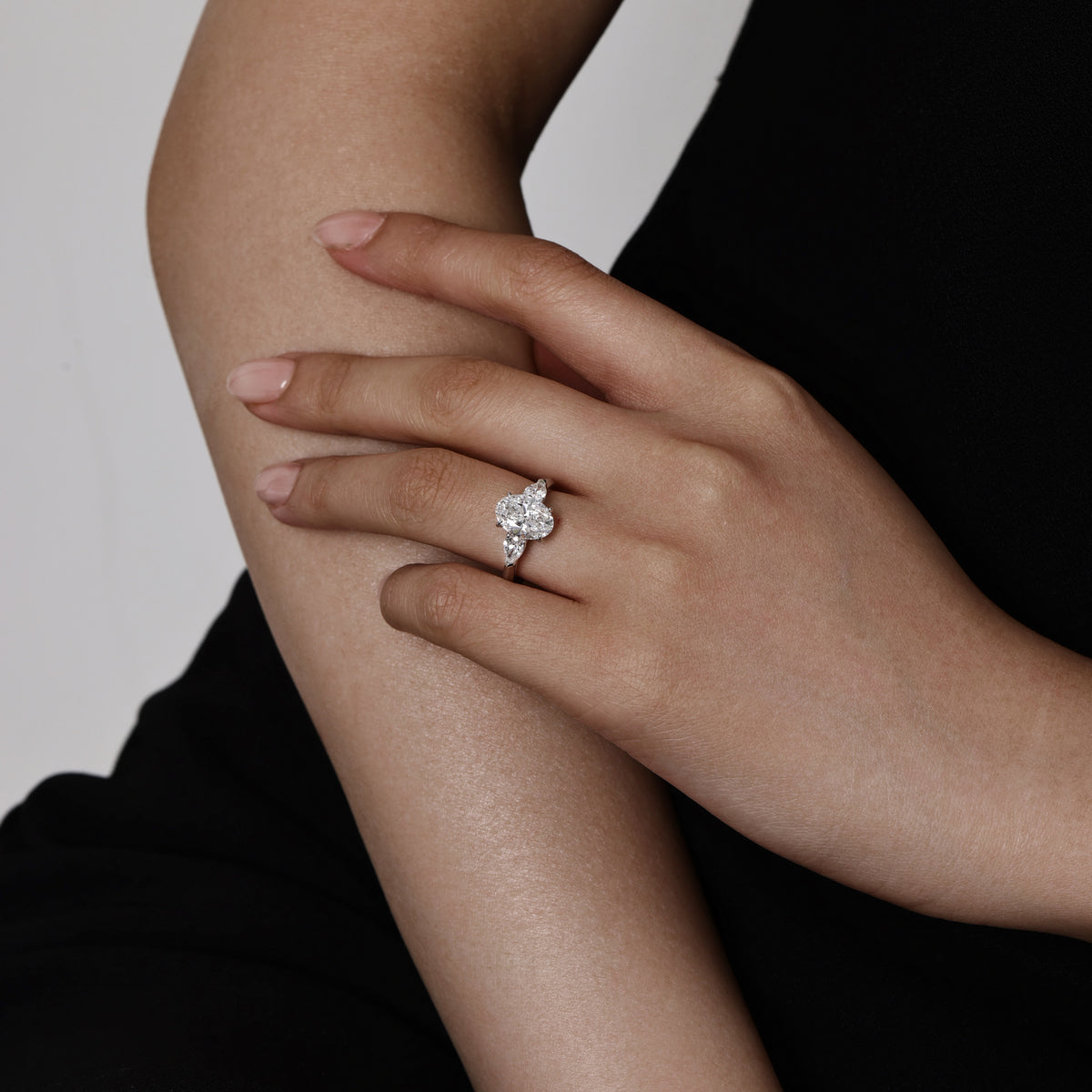 Model wearing Three-Stone Oval diamond engagement ring | Dakota | Elora