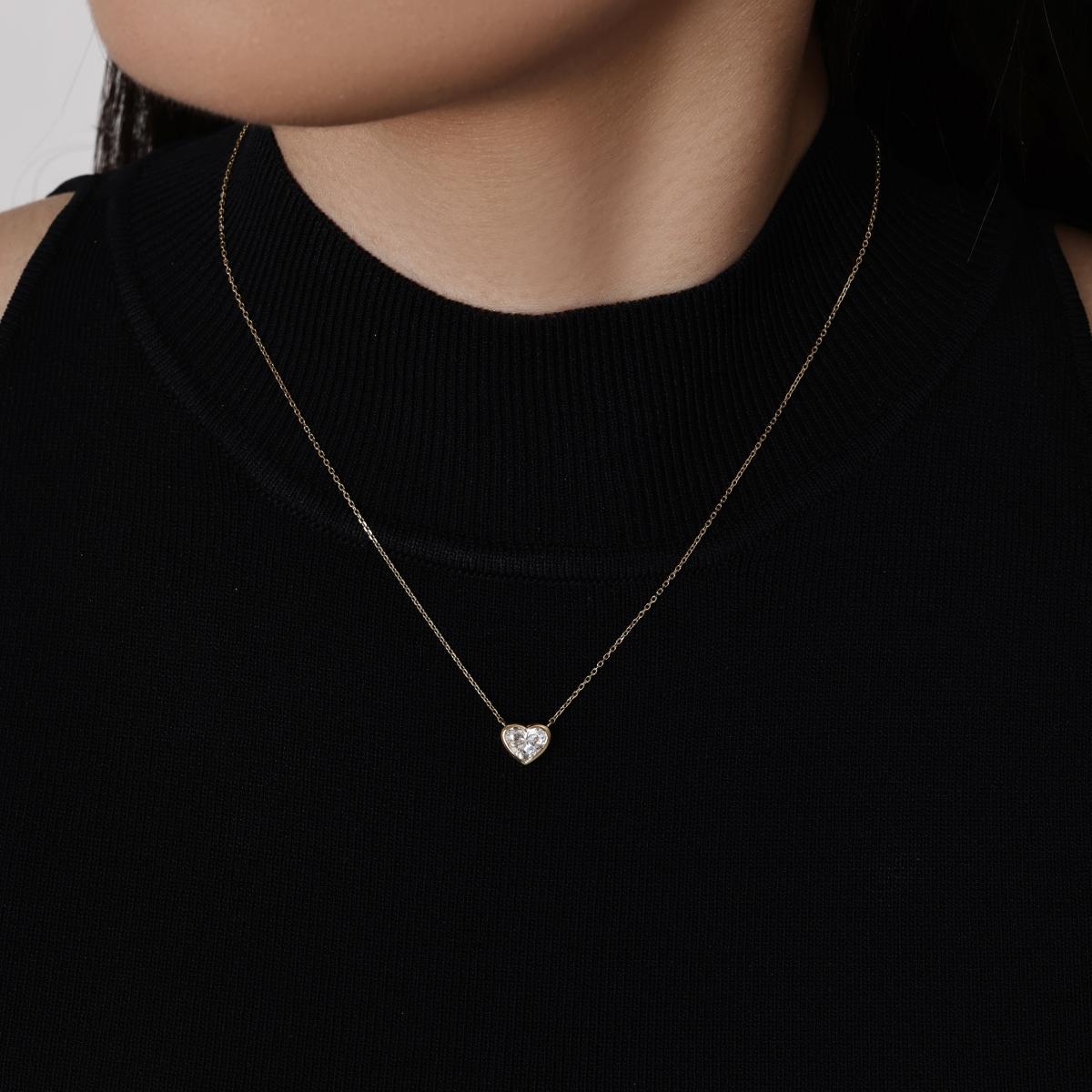 Model wearing a 1.0ct Heart Bezel Diamond Necklace 16–18" Chain Length (adjustable)