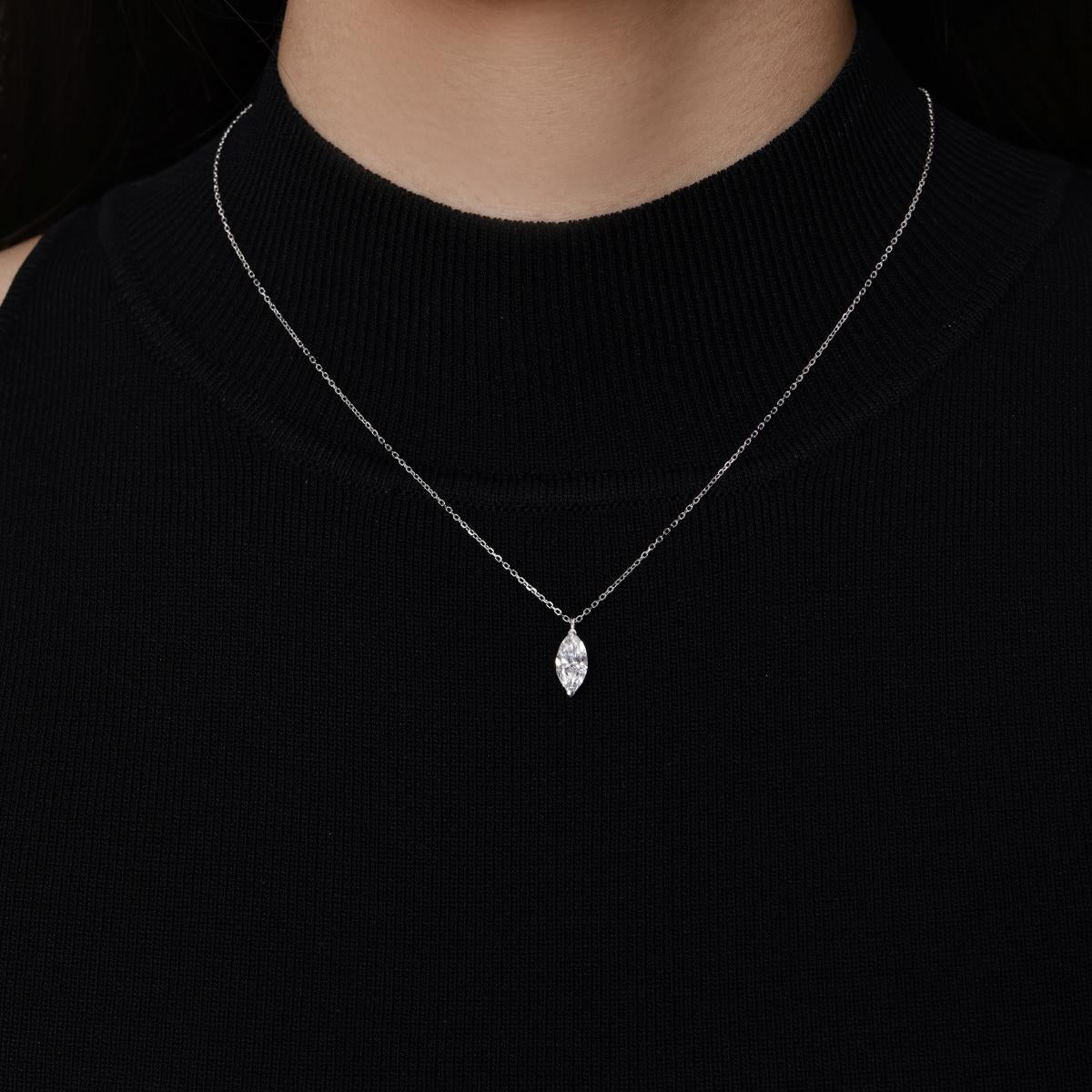 Model wearing a 1.0ct Marquise cut Solitaire Diamond Necklace in platinum 16–18" Chain Length (adjustable)