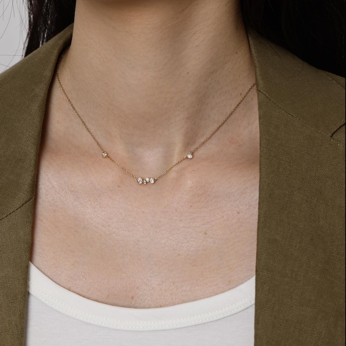 Model wearing a six round cut lab-grown bezel set Diamonds Necklace