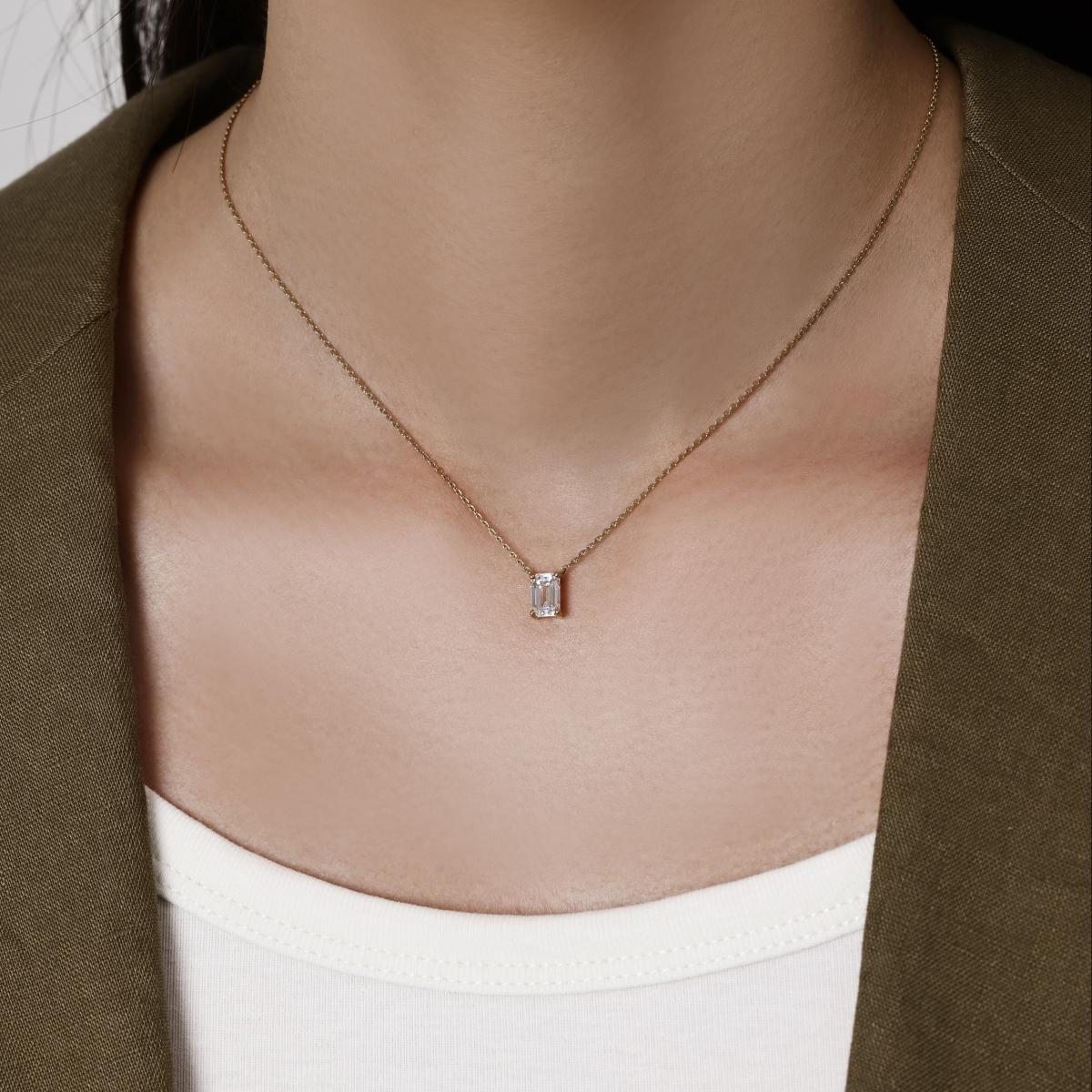 Model wearing an Emerald Cut Diamond Necklace 16–18" Chain Length (adjustable)