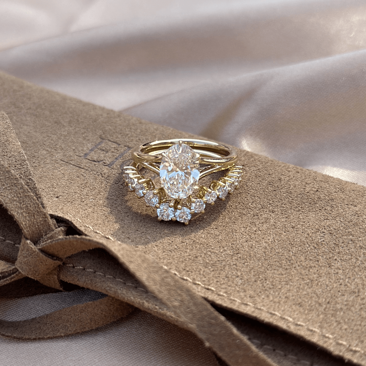 Oval Diamond ring paired with a contour band, showcasing versatile styling options