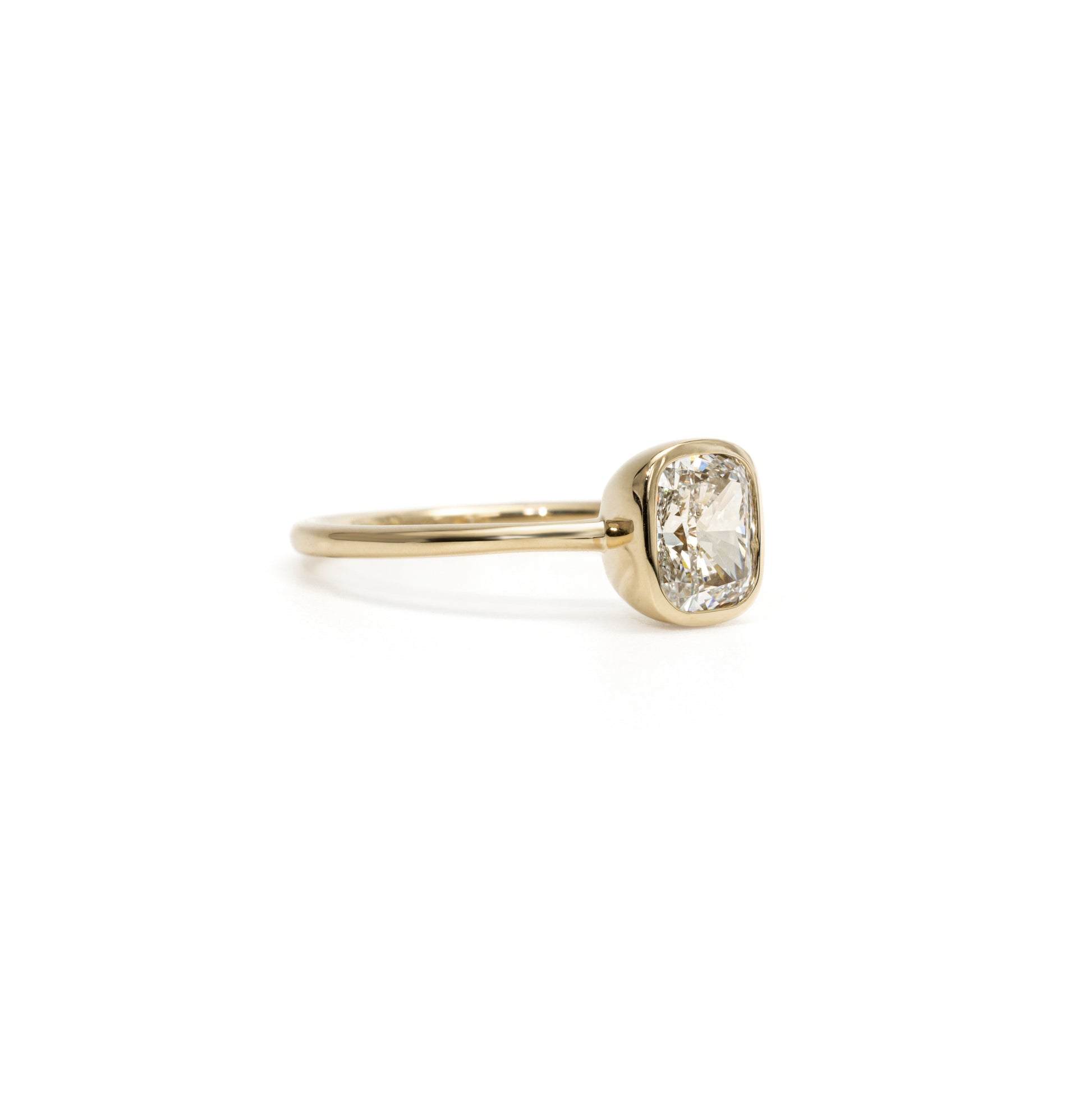 Side Profile showing the slim bezel setting of Hazel Cushion Cut Diamond Solitaire Ring
