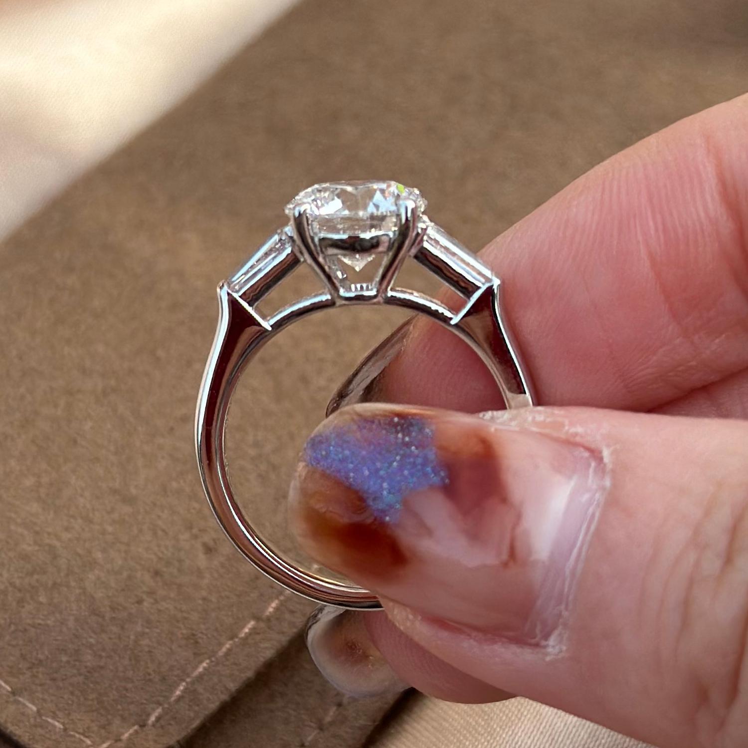 Side profile of Amber Three Stone Round Cut Lab Grown Diamond Ring in platinum