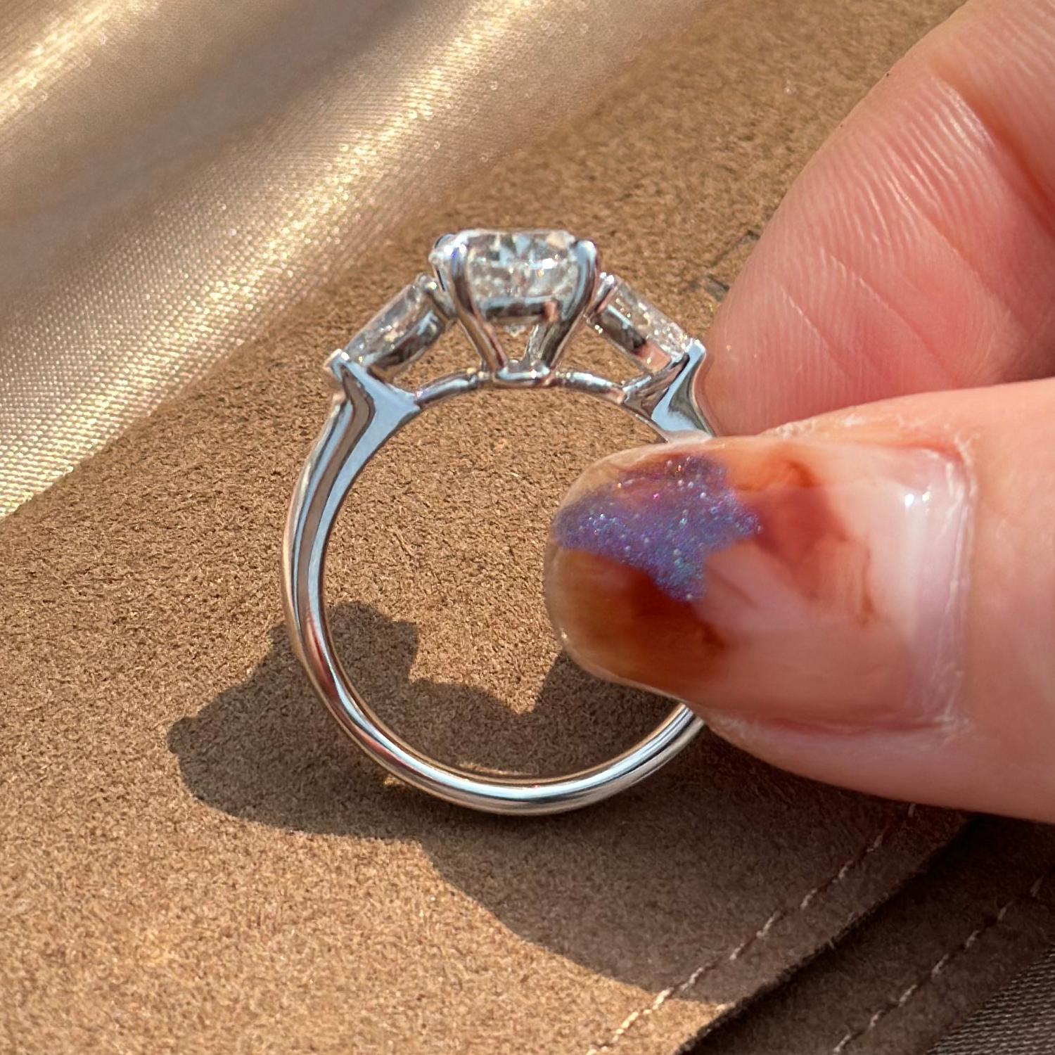 Side profile of Dakota Three Stone Oval Cut Lab Grown Diamond Ring in platinum