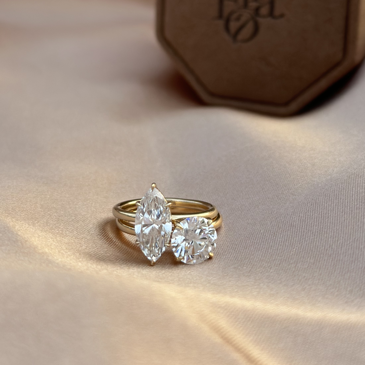 Stacked look featuring Marquise cut diamond ring paired with a round-shaped solitaire