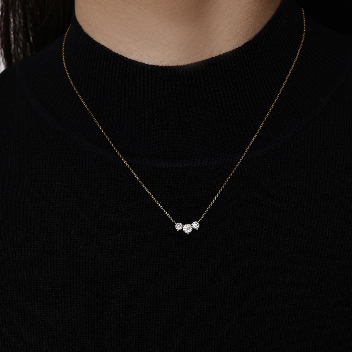 Three Stone Round cut Diamond Necklace 4.3mm & 3.4mm diamond diameter in black background