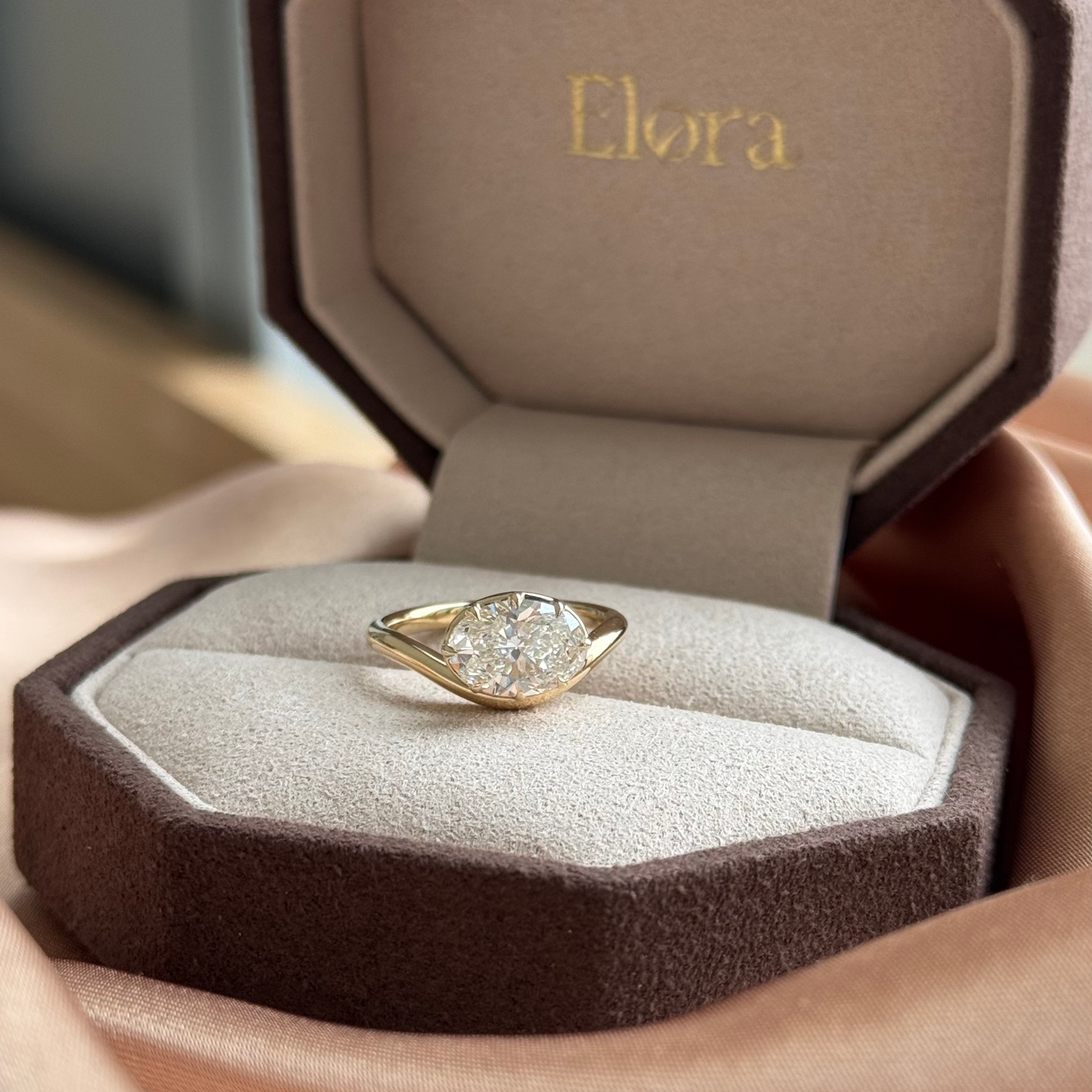 Wave-Oval Cut Lab Grown Diamond Engagement Ring displayed in elegant Elora jewelry box.
