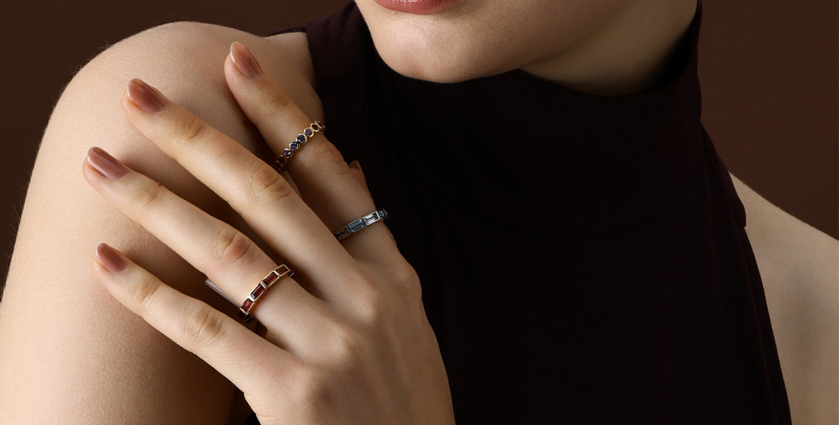 Gemstone Garnet rings elegantly displayed on a model's hand, showcasing natural beauty and craftsmanship.