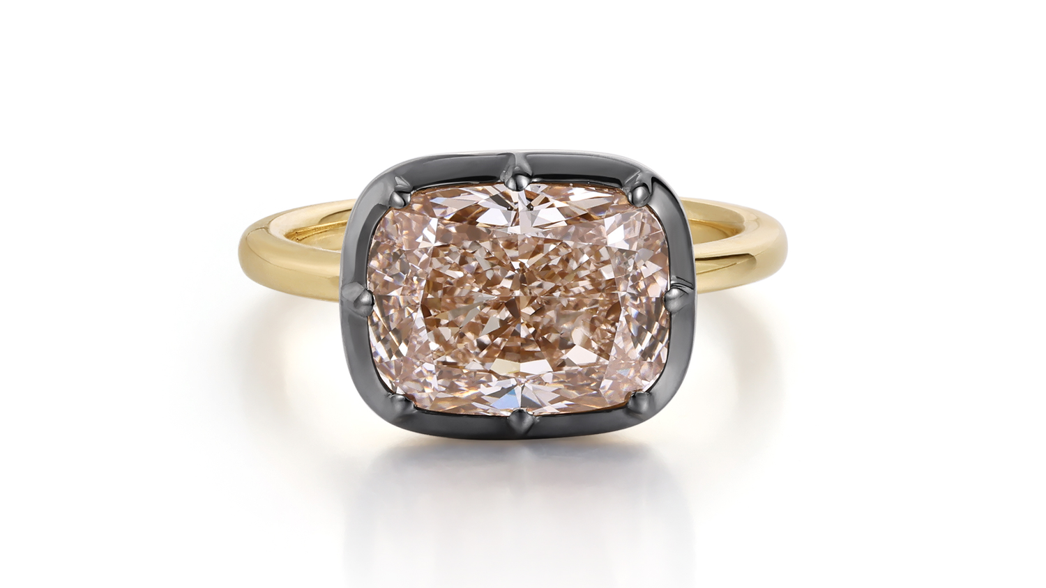 Black Gold Engagement Ring featuring a fancy colored diamond in a black gold setting and yellow gold band.