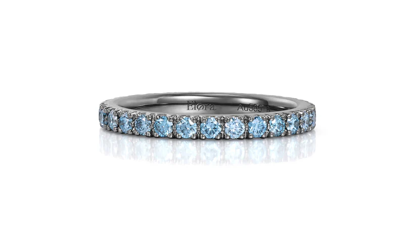 Black Gold Wedding Band featuring light blue lab grown diamonds in a continuous band design.