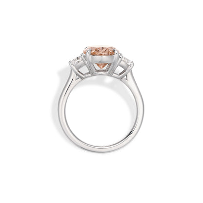 Side profile of pink oval cut lab grown diamond ring with half-moon diamond side stones