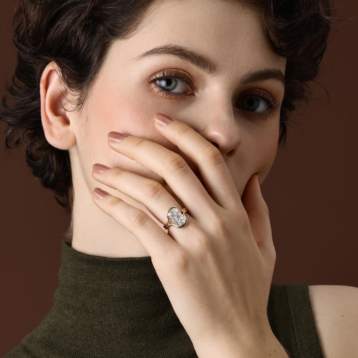 Model wearing an old mine cut lab grown diamond engagement ring