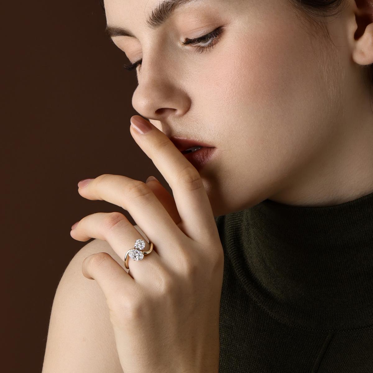 Model wearing Oval and Cushion cut Lab Grown Diamond Toi et Moi Engagement Ring