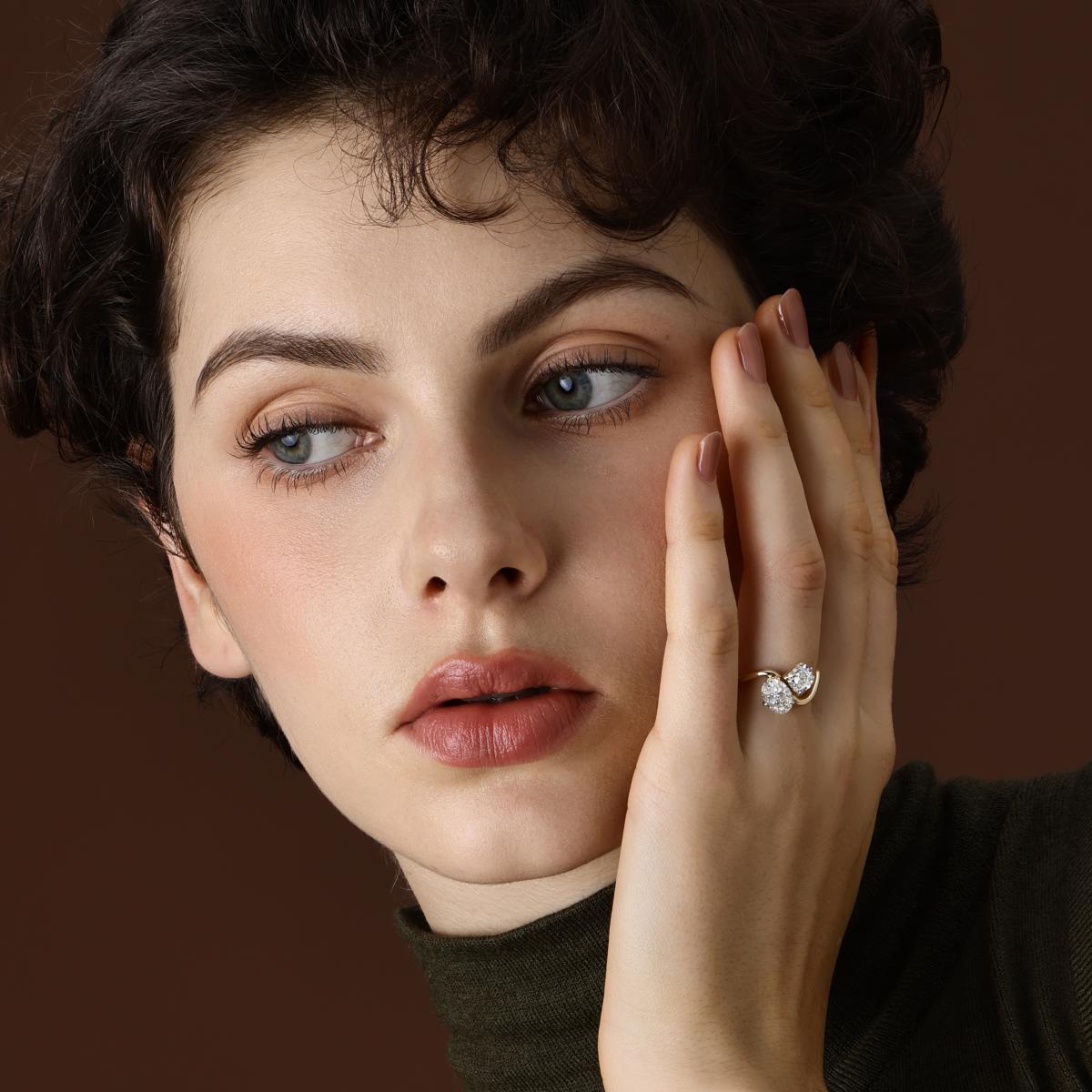 The Idra Oval and Cushion cut Lab Grown Diamond Toi et Moi Engagement Ring worn on hand