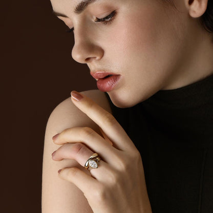 Model wearing Marquise cut lab grown diamond engagement ring styled with matching curved gold band
