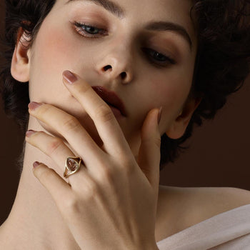 Champagne pear cut lab grown diamond engagement ring in brushed 14K yellow gold