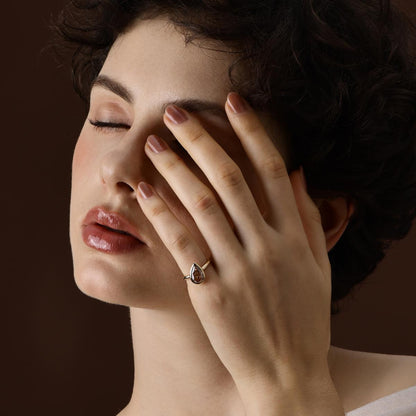 Model wearing Champagne Pear Lab Grown Diamond Engagement Ring with bezel setting