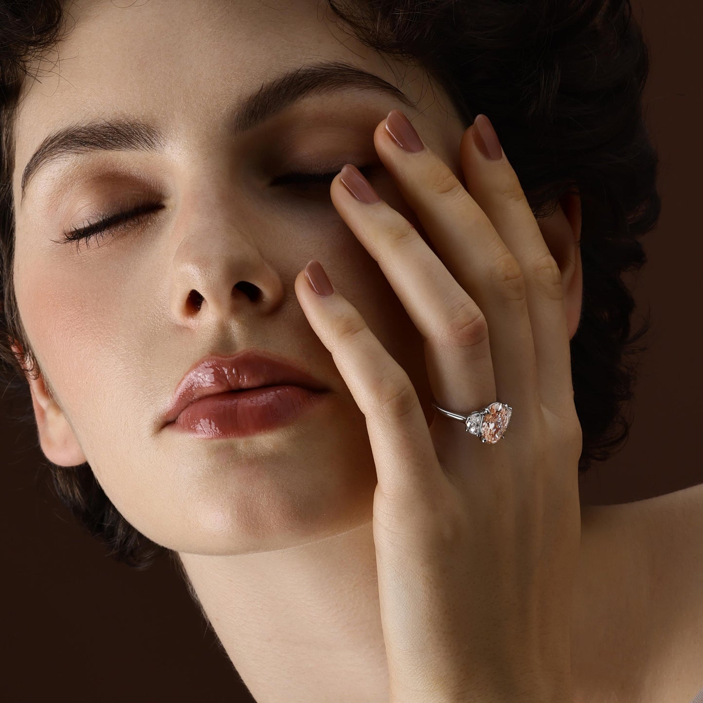 Model wearing a pink oval cut lab grown diamond engagement ring