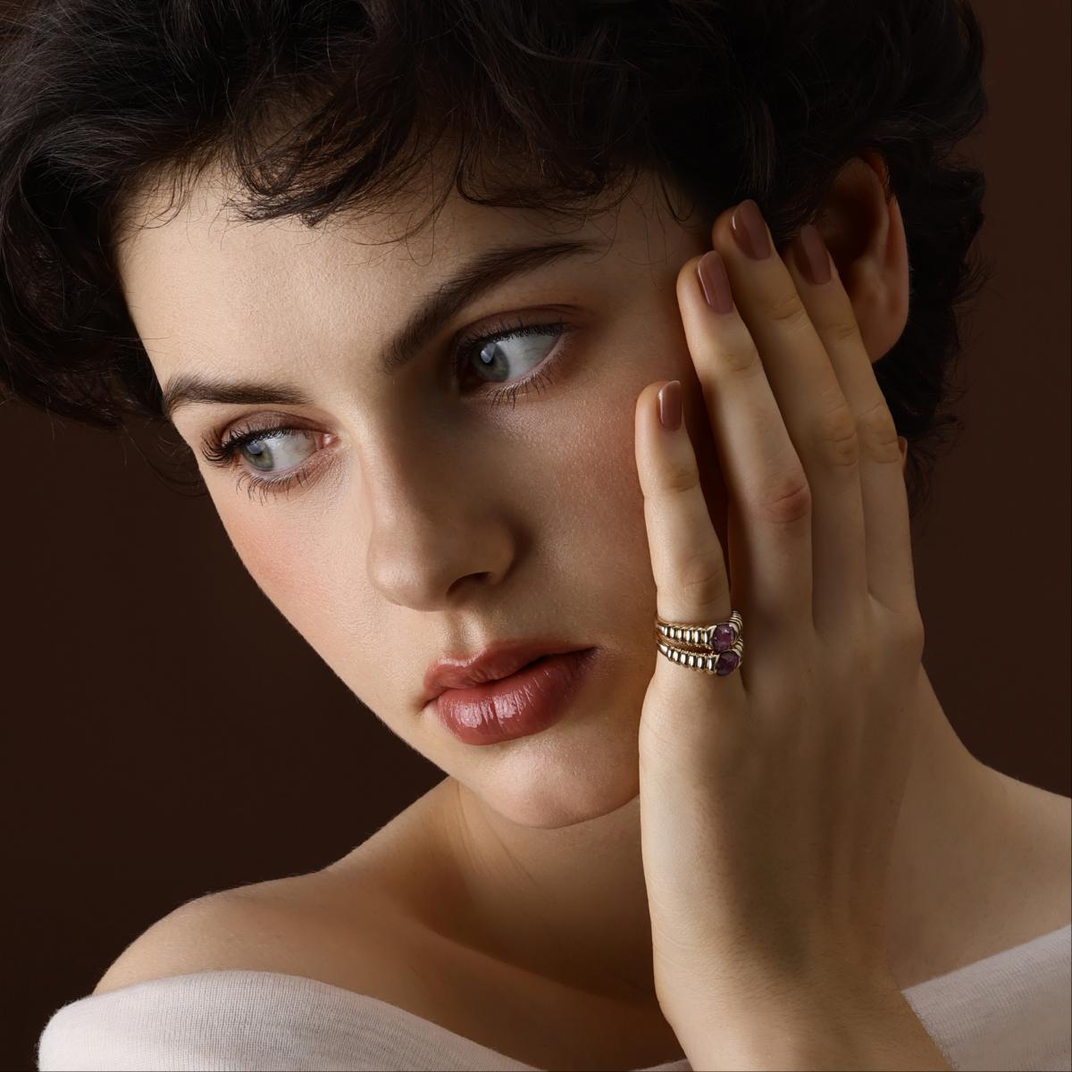 Model wearing a Cushion Cut Deep Purple Spinel Ring styled with a Cushion Cut Purple Spinel Ring