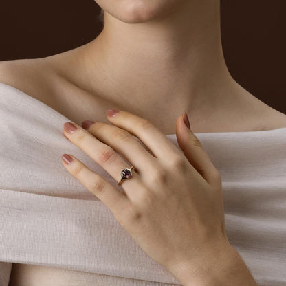 Model Wearing Cushion Cut Deep Purple Spinel Ring in yellow gold