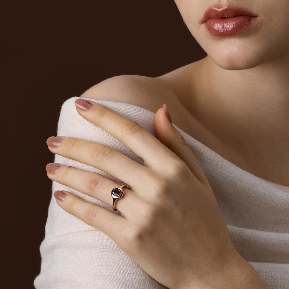 The Ellie Cushion Cut Deep Purple Spinel Ring worn on hand