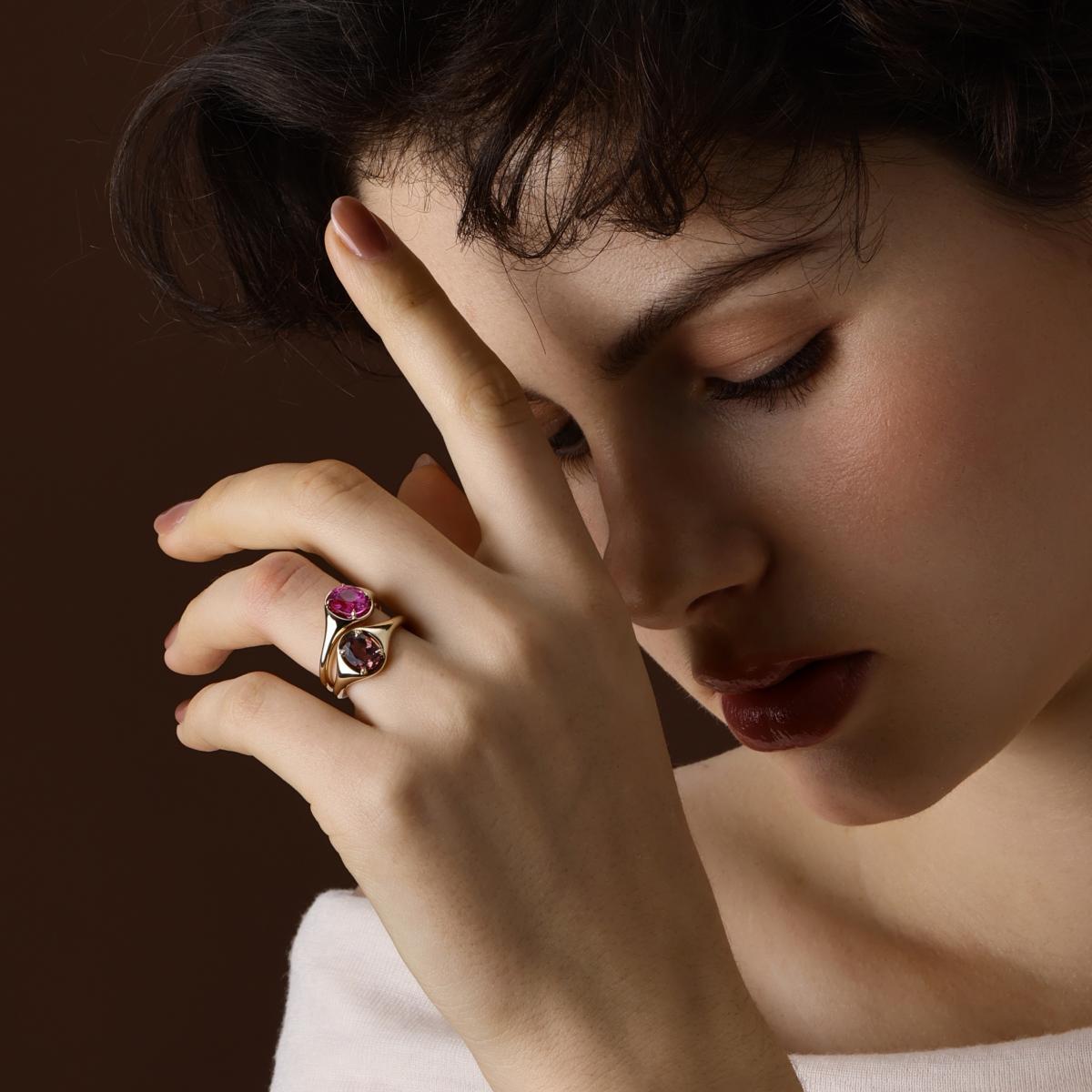 Model Wearing the Evie Oval Cut Lab Grown Pink Sapphire Ring styled with an oval red Tourmaline Ring