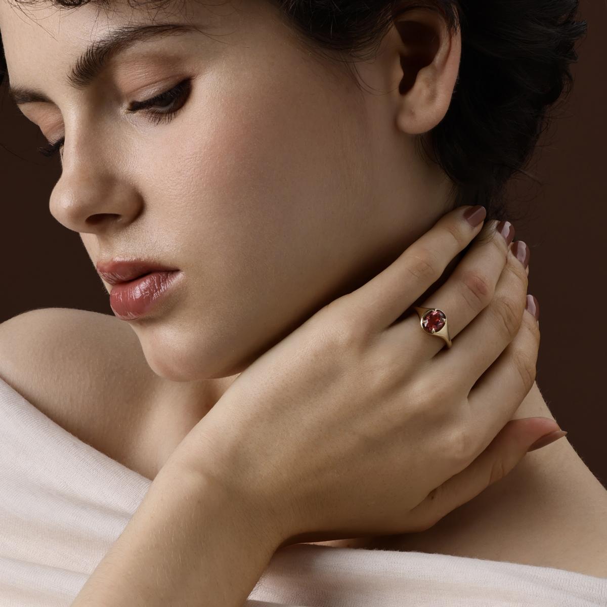  Oval Cut red Tourmaline Ring in 14K Yellow Gold worn on hand