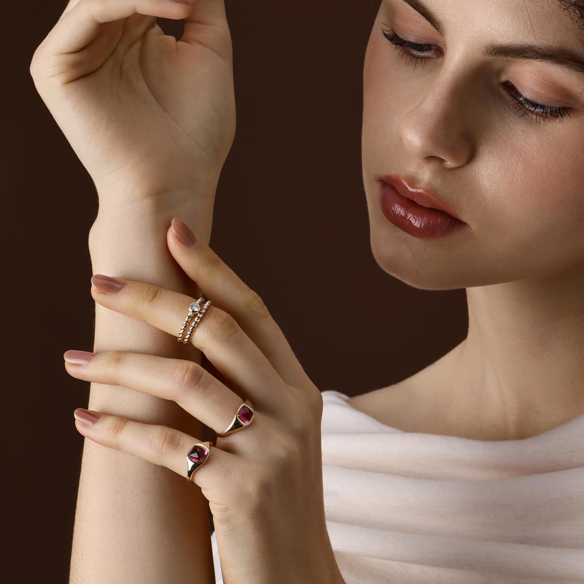 Model wearing 2 Sugarloaf Cabochon Pink Tourmaline Rings