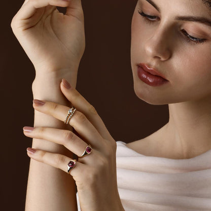 Model wearing 2 Sugarloaf Cabochon Pink Tourmaline Rings