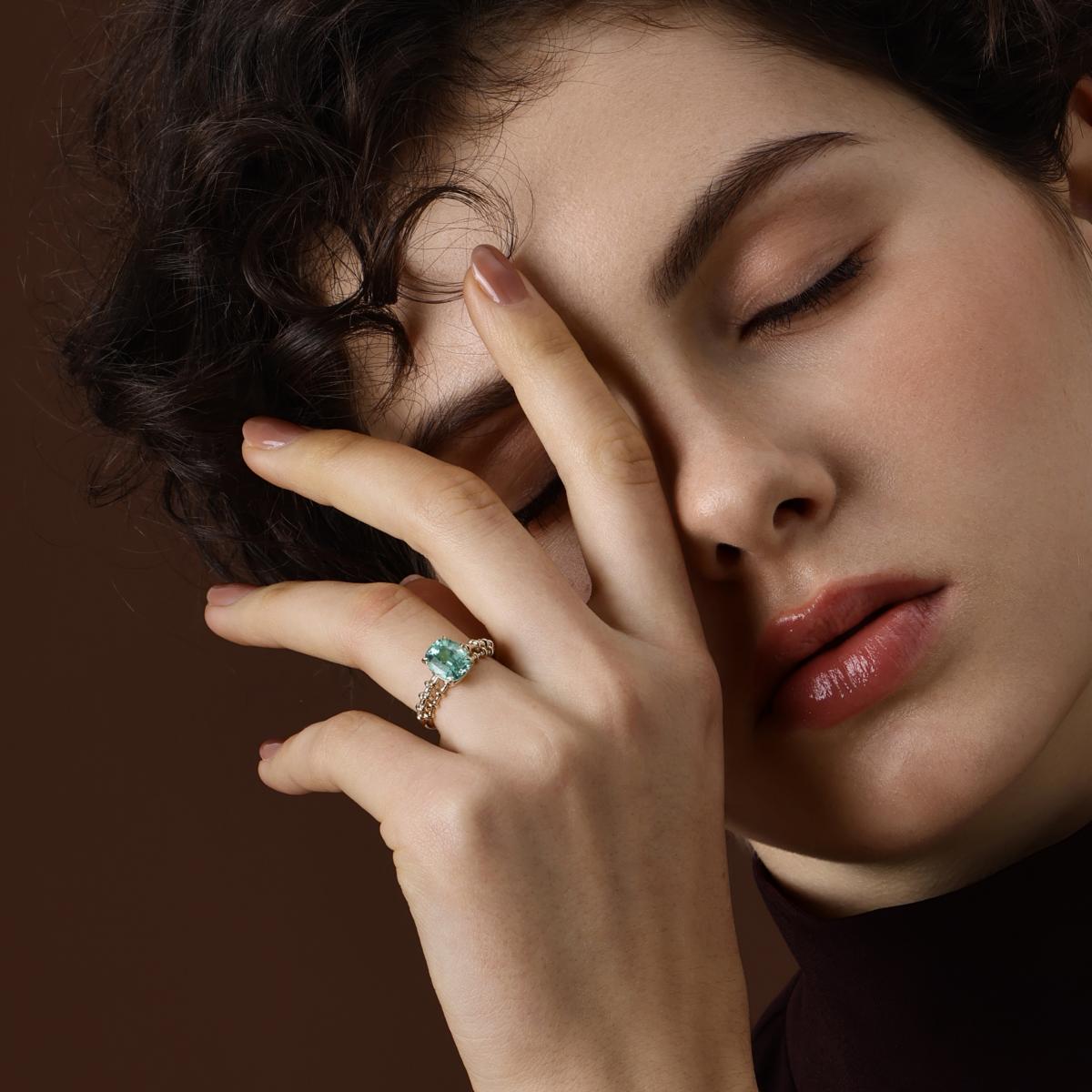 Model wearing the Jill Cushion Cut Lab Grown Mint Green Sapphire Ring in 14k yellow gold